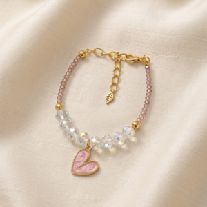 Delicate bracelet with iridescent clear crystal beads, small lilac seed beads, pink enamel marble heart charm and gold leaf extender clasp