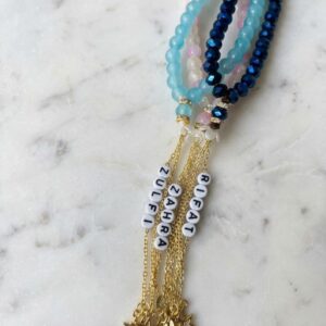 Colorful crackle glass bead tasbeeh with gold tassel chains, star charms, and custom name tags spelling different names